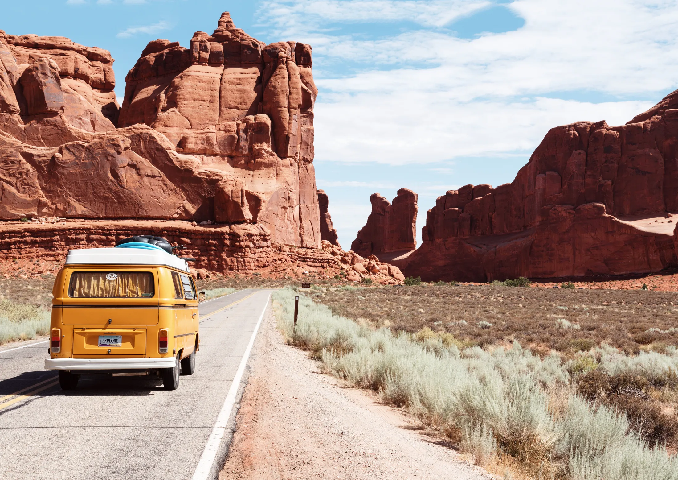 Open Arizona highway winding through red rock desert